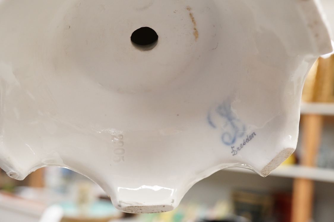 A pair of German porcelain figure groups, late 19th century and a Dresden centrepiece bowl-29cm high